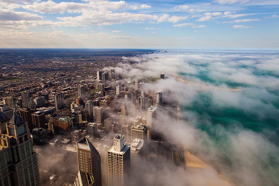Chicago, IL Insurance - Aerial View of Chicago Area and Lake Michigan With Mist Floating Over the City